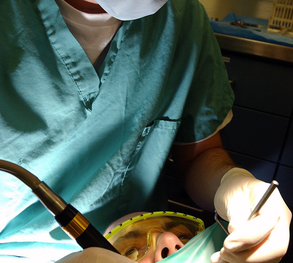 040324-N-8213G-148
USS Ronald Reagan (CVN 76), March 24, 2004 – Lt. Cmdr. David Craig, of Brilliant, Ohio, performs a root canal on his patient, Machinist Mate 2nd Class (SW) Ben Farrell of 
St. Paul, Minn. The ship is preparing to leave for its homeport in San Diego, and is undergoing a six-month Post Shakedown Availability period at Northrop Grumman Newport News Shipbuilding, Newport News, Va. U.S. Navy photo by Photographer's Mate Airman Konstandinos Goumenidis. RELEASE